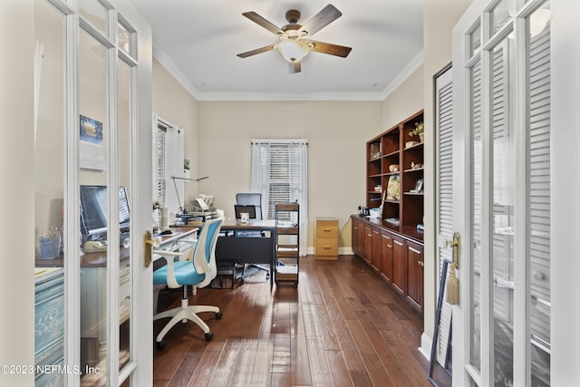 home office with dark wood-type flooring, ornamental molding, and ceiling fan