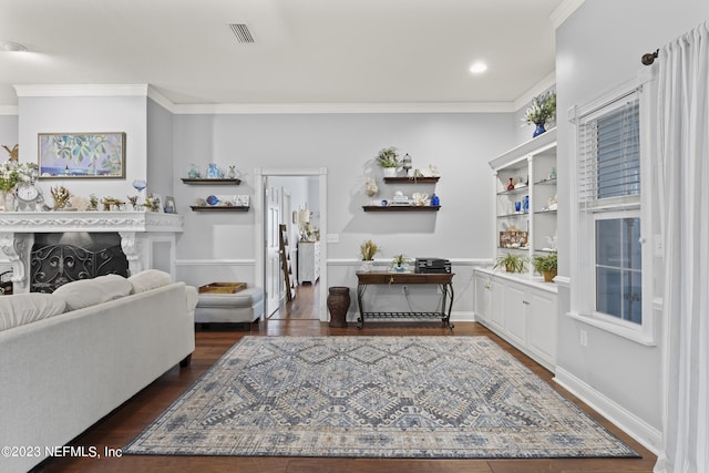 living room with ornamental molding and dark hardwood / wood-style flooring