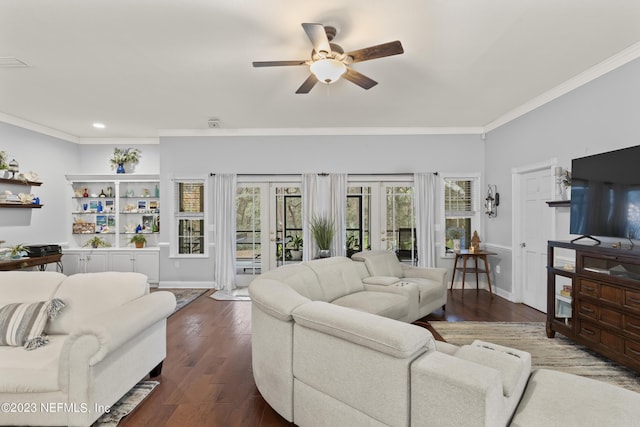 living room featuring crown molding, ceiling fan, dark hardwood / wood-style floors, and french doors