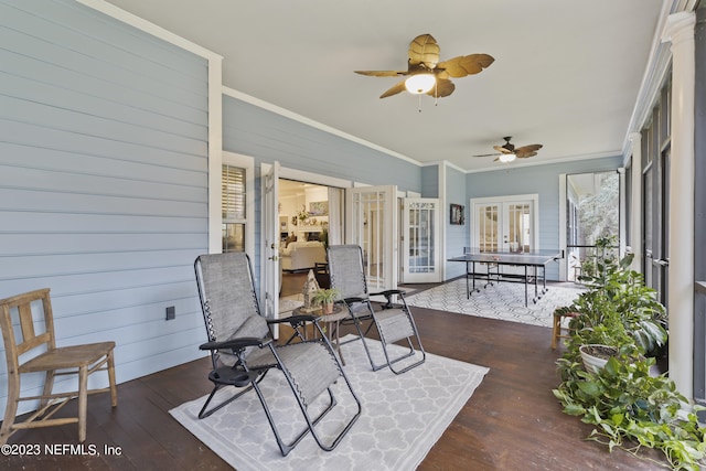 sunroom with french doors and ceiling fan