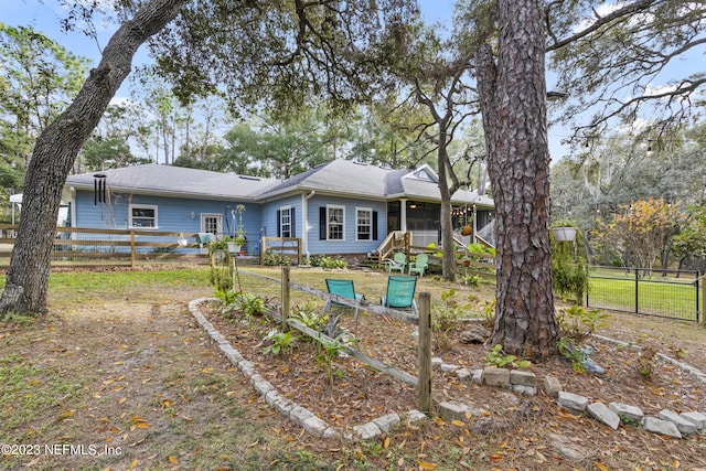 rear view of house with a sunroom