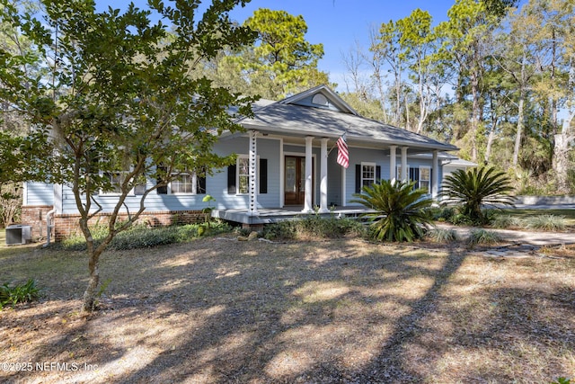 view of front of property with central AC and a porch