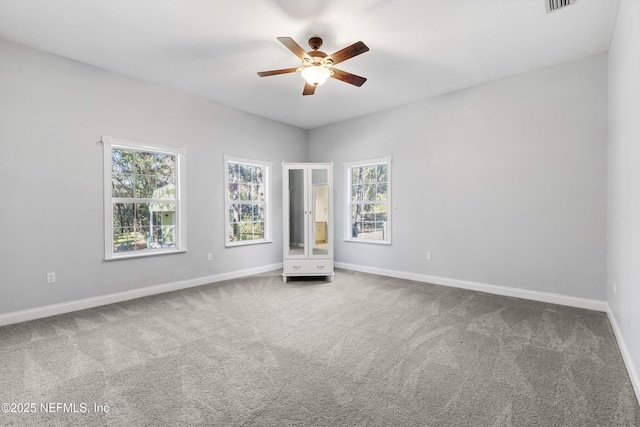 unfurnished bedroom with ceiling fan and carpet flooring