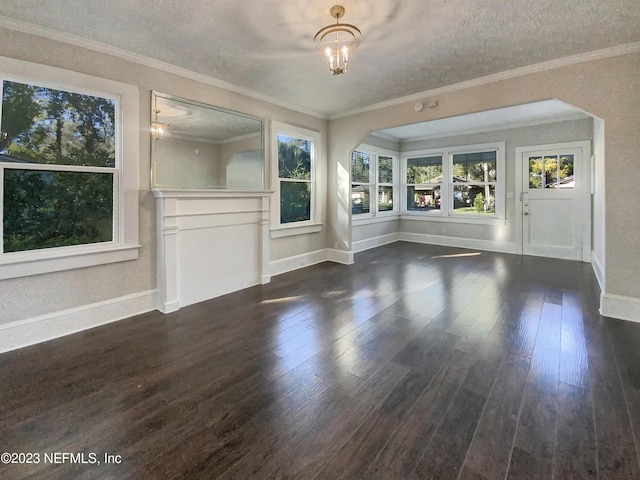 interior space with crown molding, dark wood-type flooring, a textured ceiling, and an inviting chandelier