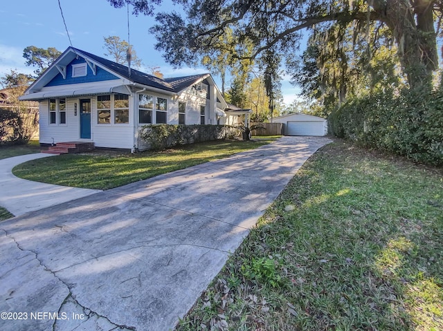 view of property exterior with a yard, an outdoor structure, and a garage