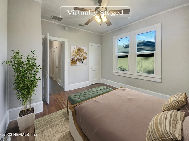 bedroom with ceiling fan, dark hardwood / wood-style flooring, and ornamental molding