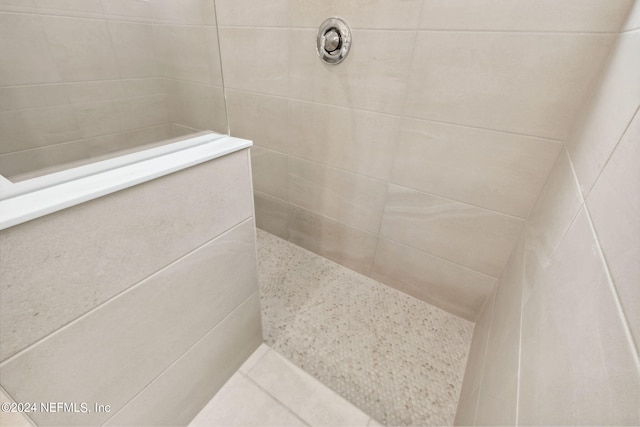 bathroom with tiled shower