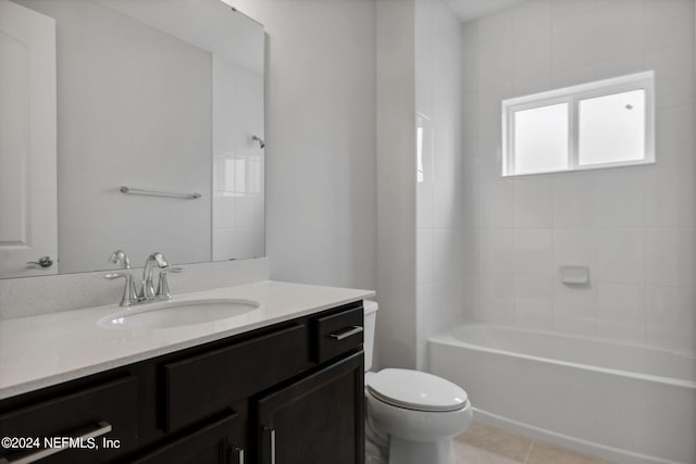 full bathroom featuring tile patterned floors, bathing tub / shower combination, vanity, and toilet