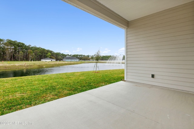 view of patio with a water view