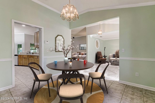 dining area with light tile patterned floors, lofted ceiling, a notable chandelier, baseboards, and ornamental molding