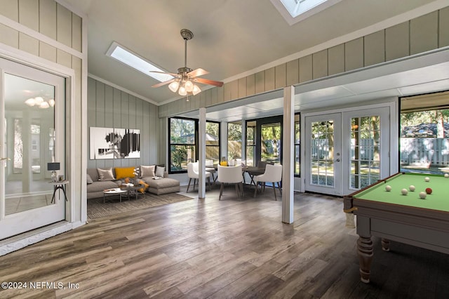 sunroom with vaulted ceiling with skylight, billiards, ceiling fan, and french doors