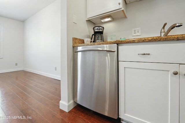 4358 Timuquana Rd Unit 205, Jacksonville, FL 32210 - detailed view of stainless steel dishwasher, dark wood-style flooring, baseboards, white cabinetry, and a sink