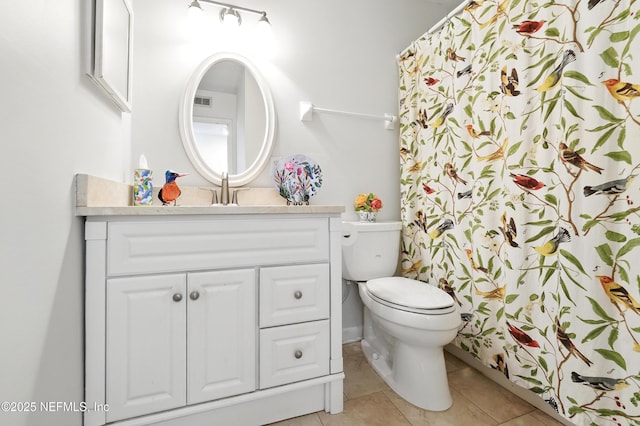 4358 Timuquana Rd Unit 205, Jacksonville, FL 32210 - full bath featuring vanity, toilet, tile patterned flooring, and a shower with shower curtain