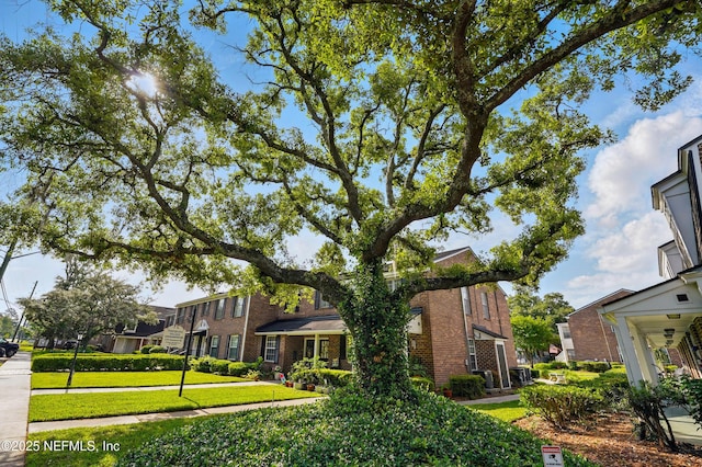 4358 Timuquana Rd Unit 205, Jacksonville, FL 32210 - view of front of home featuring brick siding and a front yard