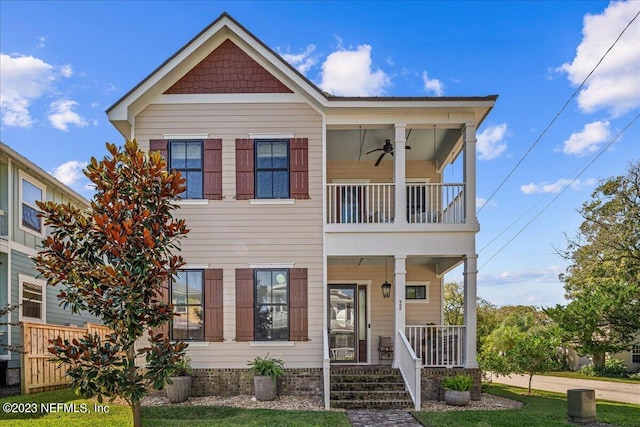 view of front facade featuring a porch, a balcony, and ceiling fan