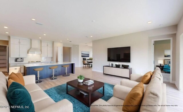 living area featuring light wood-style floors, visible vents, and recessed lighting