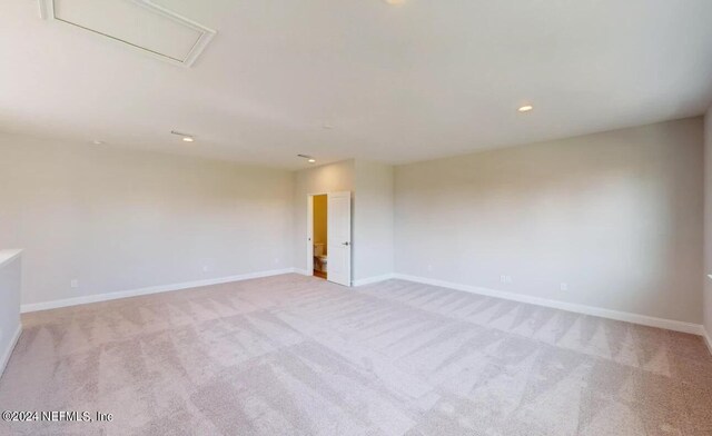 empty room featuring baseboards, carpet flooring, and recessed lighting