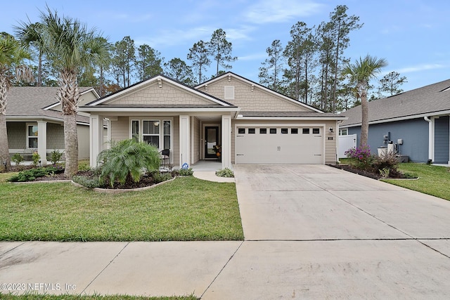 view of front of property featuring a porch, a garage, and a front lawn