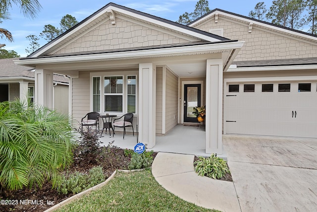 view of front of house featuring a garage and covered porch