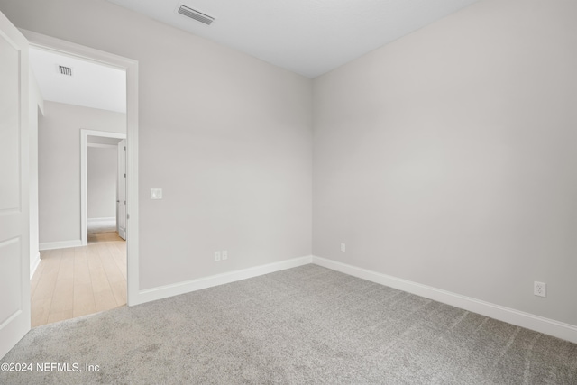 empty room featuring carpet flooring