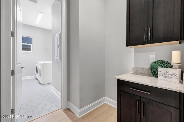 interior space featuring independent washer and dryer and light hardwood / wood-style floors