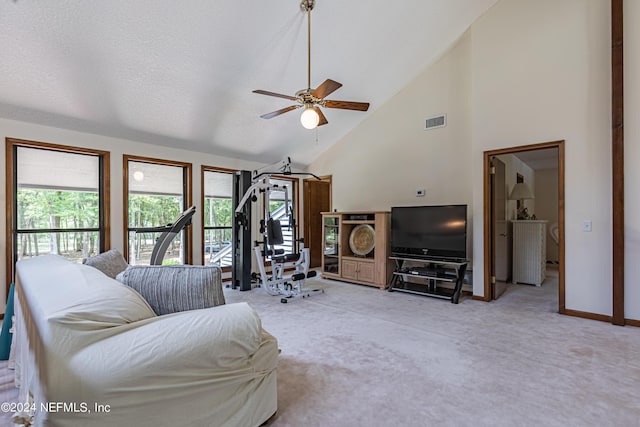 living room featuring ceiling fan, light colored carpet, and high vaulted ceiling