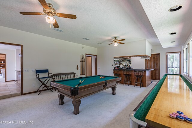 rec room featuring ceiling fan, carpet flooring, billiards, a textured ceiling, and indoor bar