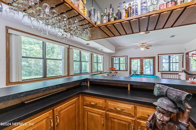 kitchen with ceiling fan, pool table, and french doors