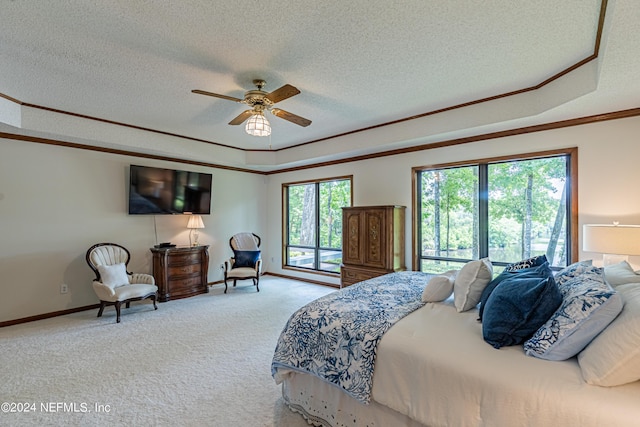 bedroom featuring ceiling fan, access to exterior, ornamental molding, a textured ceiling, and carpet flooring