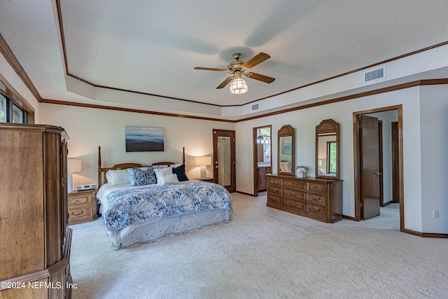 bedroom featuring a textured ceiling, ceiling fan, ornamental molding, and light carpet