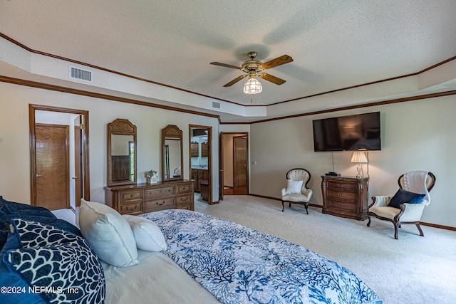 carpeted bedroom with ceiling fan, a textured ceiling, a tray ceiling, and crown molding