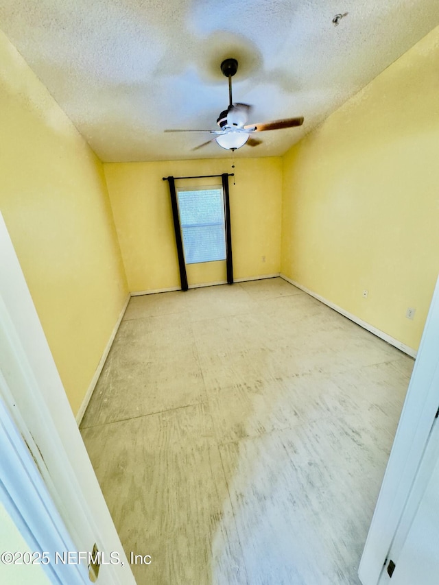 empty room with a textured ceiling