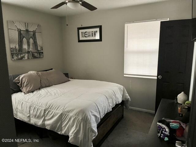 bedroom featuring carpet floors and ceiling fan