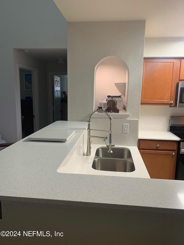 kitchen featuring stainless steel appliances and sink