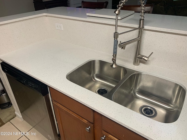 room details featuring dishwasher, sink, and tile patterned floors