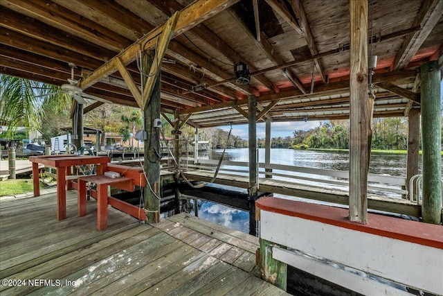 view of dock with a water view and boat lift