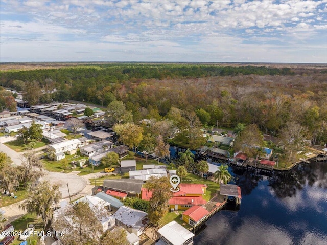 drone / aerial view featuring a water view and a residential view