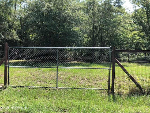surrounding community with a gate and fence