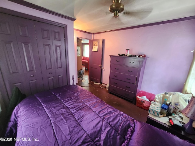 bedroom featuring a closet, ceiling fan, and ornamental molding