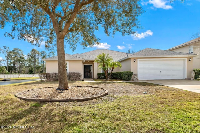 single story home with a front lawn and a garage