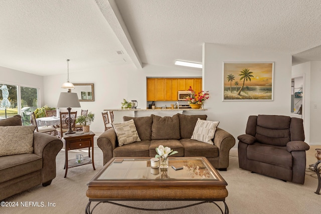 living room featuring light colored carpet, a textured ceiling, and lofted ceiling with beams