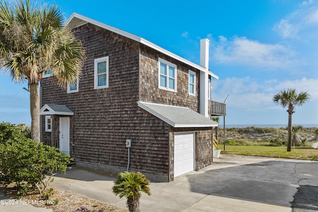 view of side of home featuring a garage