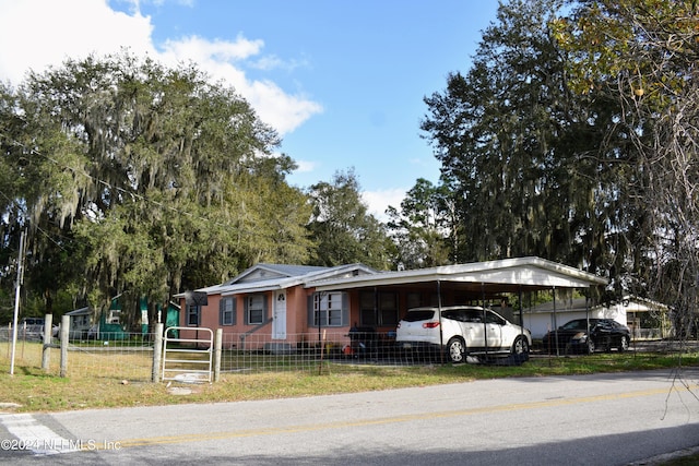 view of front of home featuring a carport