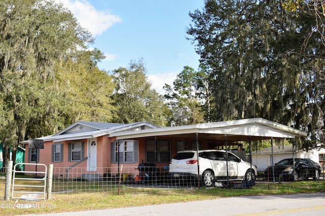 view of front of house featuring a carport