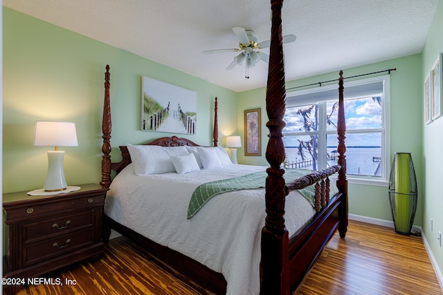 bedroom featuring dark hardwood / wood-style floors and ceiling fan