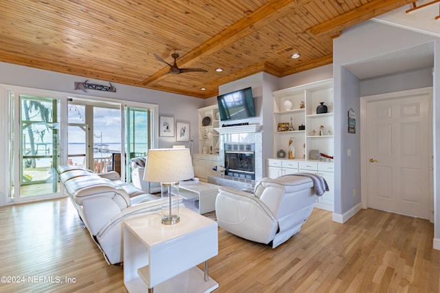 living room with ceiling fan, wood ceiling, a high end fireplace, light hardwood / wood-style flooring, and a healthy amount of sunlight