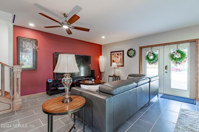 living room featuring ceiling fan, a healthy amount of sunlight, french doors, and tile floors