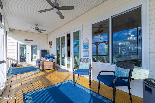 deck with french doors and ceiling fan