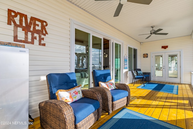 wooden deck featuring ceiling fan and french doors