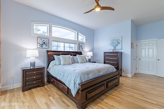 bedroom featuring light hardwood / wood-style flooring and ceiling fan